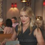 Camille’s black vest and shoulder bag on Emily in Paris
