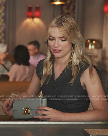 Camille’s black vest and shoulder bag on Emily in Paris