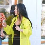 Danna’s yellow nylon coat and sneakers on The Real Housewives of Salt Lake City