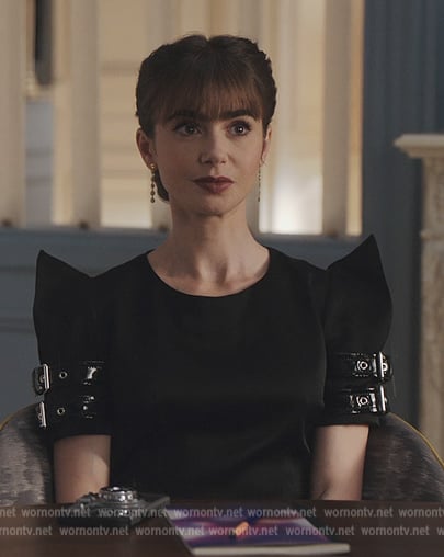 Emily’s black buckle sleeve mini dress on Emily in Paris