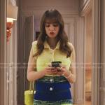 Emily’s yellow knit top and feather trim skirt on Emily in Paris
