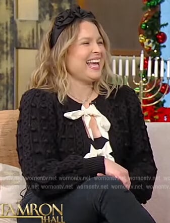 Joanna Teplin’s black contrast bow cardigan on Tamron Hall Show