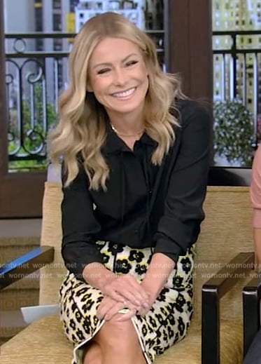 Kelly’s black tie neck blouse and floral skirt on Live with Kelly and Ryan