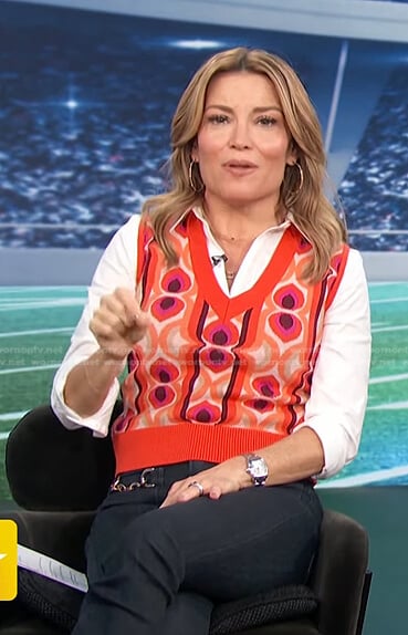 kit’s orange print vest and jeans on Access Hollywood