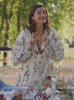 Louise’s white floral embroidered dress on Emily in Paris