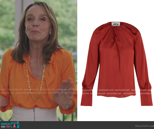 Maison Rabih Kayrouz Draped Blouse in Marigold worn by Sylvie (Philippine Leroy-Beaulieu) on Emily in Paris