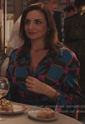 Marianne’s blue geometric print dress on Emily in Paris