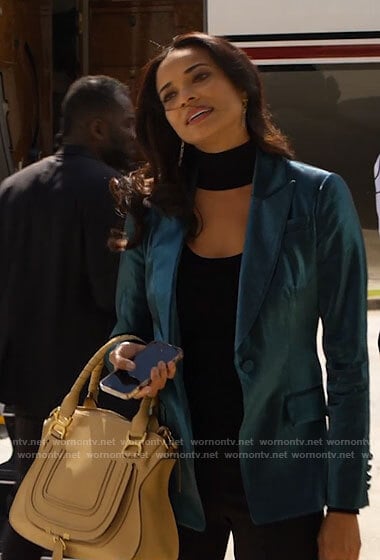 Mackenzie’s teal blazer and yellow bag on Monarch