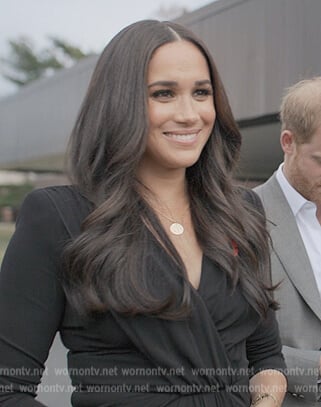 Meghan Markle’s black wrap front dress on Harry and Meghan