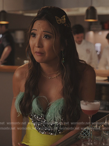 Mindy’s yellow embellished feather dress on Emily in Paris