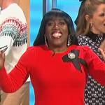 Sheryl’s red bow brooch sweater on The Talk