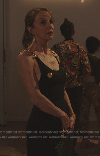 Sylvie’s black chain strap dress on Emily in Paris