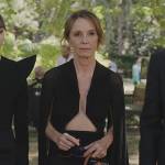 Sylvie’s black cape blouse on Emily in Paris
