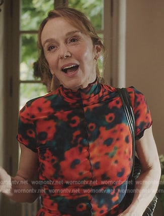 Sylvie’s red floral print dress on Emily in Paris