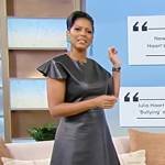 Tamron’s black leather asymmetric dress on Tamron Hall Show