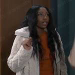 Trina’s orange drawstring knit top and furry jacket on General Hospital