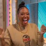Aisha Tyler’s Malcom X embroidered sweater on Sherri