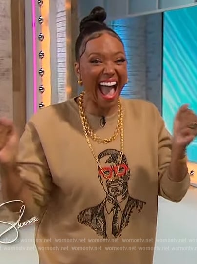 Aisha Tyler’s Malcom X embroidered sweater on Sherri