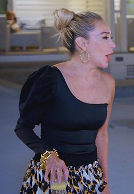 Marysol’s black one shoulder puff sleeve top on The Real Housewives of Miami