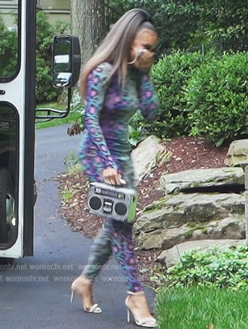 Ashley’s snakeskin jumpsuit and bag on The Real Housewives of Potomac