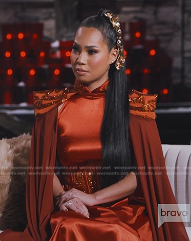 Danna’s orange corset jumpsuit with cape on The Real Housewives of Salt Lake City