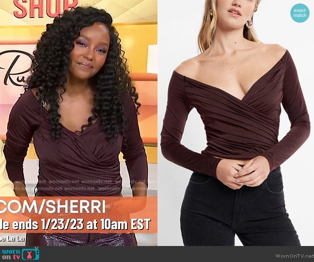 Express Body Contour Silky Long Sleeve Wrap Top worn by Makho Ndlovu on Sherri