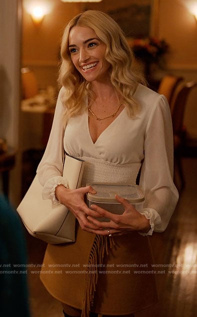 Georgia’s white smocked top and fringed wrap skirt on Ginny & Georgia