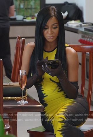 Guerdy’s black and gold cylinder bag on The Real Housewives of Miami