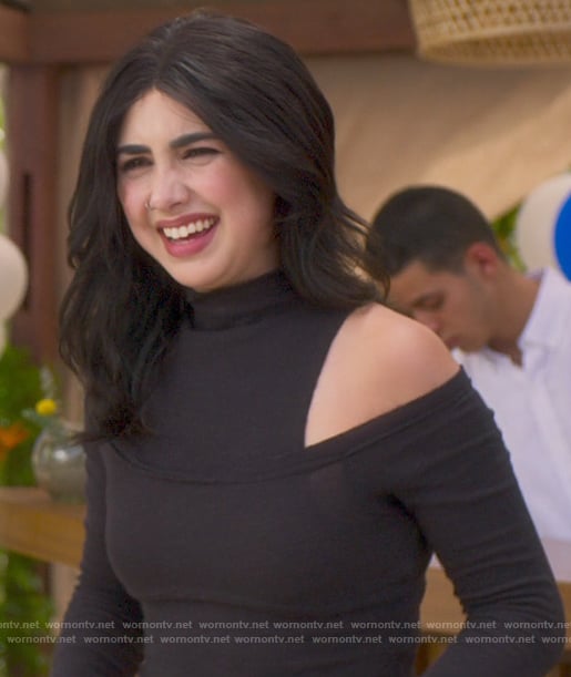 Helene’s black cutout shoulder top on Fantasy Island