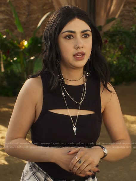 Helene’s black cutout top and leather tassel earrings on Fantasy Island