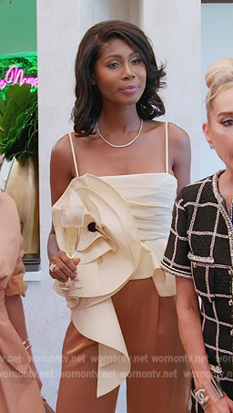Kiki’s ivory flower applique ruffle top on The Real Housewives of Miami