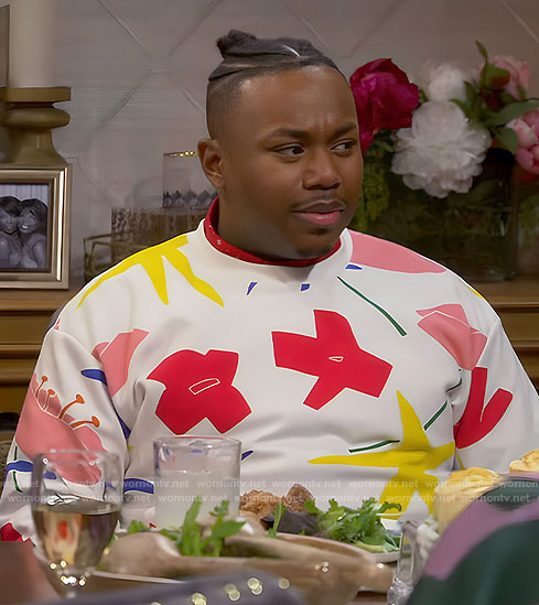 Marty’s white abstract floral sweatshirt on The Neighborhood