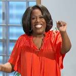 Sheryl’s red pleated tie neck blouse on The Talk