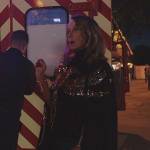 Sylvie’s black bird embellished cape on Emily in Paris
