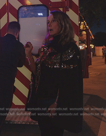 Sylvie’s black bird embellished cape on Emily in Paris