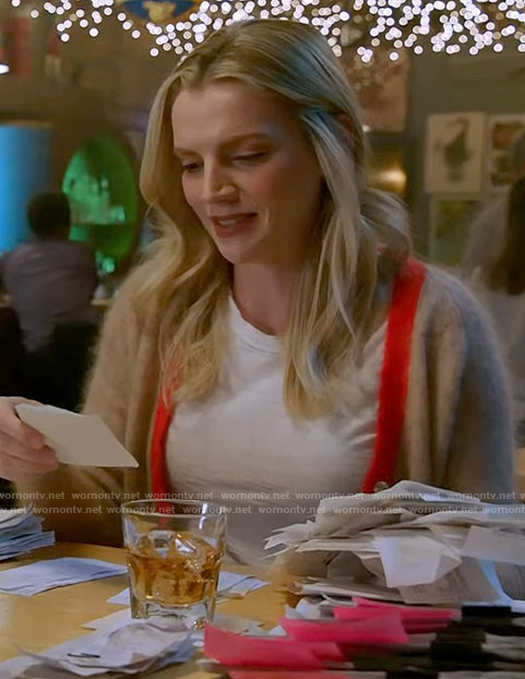Sylvie’s beige cardigan with red trim on Chicago Fire