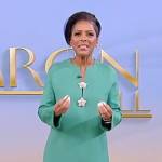 Tamron’s green star embellished dress on Tamron Hall Show