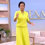 Tamron’s yellow knit polo shirt and skirt on Tamron Hall Show