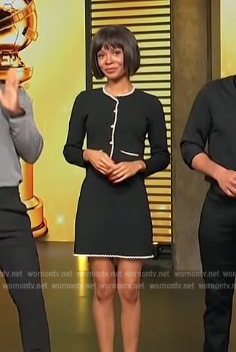 Zuri’s pearl trim cardigan and mini skirt on Access Hollywood