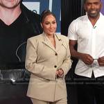 Adrienne’s beige blazer suit on E! News