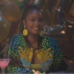 Annika’s green printed bomber jacket and skirt on Grown-ish
