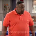 Calvin’s orange polo shirt on The Neighborhood