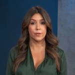 Camille Vasquez’s green surplice blouse on Access Hollywood