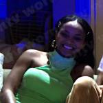 Chanel’s green sleeveless mock neck dress on Days of our Lives