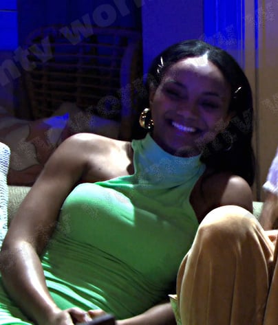 Chanel’s green sleeveless mock neck dress on Days of our Lives