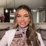 Chrishell Stause’s white printed turtleneck top on E! News