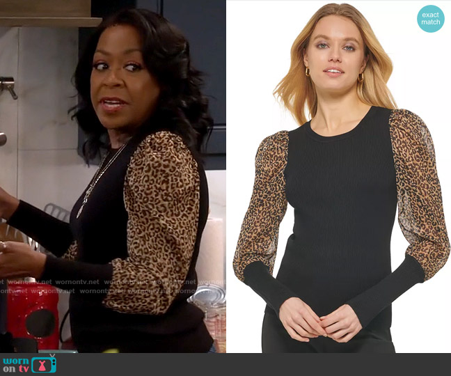 DKNY Printed Mixed-Media Long-Sleeve Sweater in Black Golden Spice Combo worn by Tina Butler (Tichina Arnold) on The Neighborhood