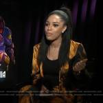 Francesca Amiker’s orange printed jacket and pants on E! News
