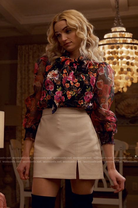Georgia’s floral blouse and white leather mini skirt on Ginny & Georgia