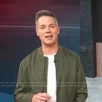 Jason Kennedy’s green bomber jacket on Access Hollywood